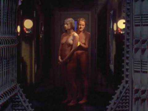 On board the spaceship, the monster pursues naked girls